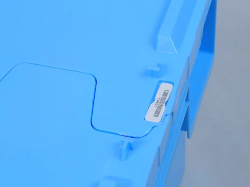 Close - up of blue tote box lid with label, enhancing identification.
