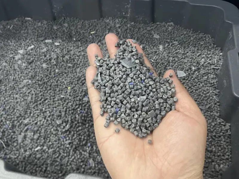 Gray plastic crates made from virgin HDPE & PP, showcasing durable material construction.