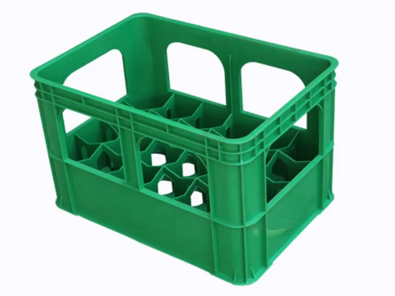Green plastic beer crate, with dividers, for bottle transport.