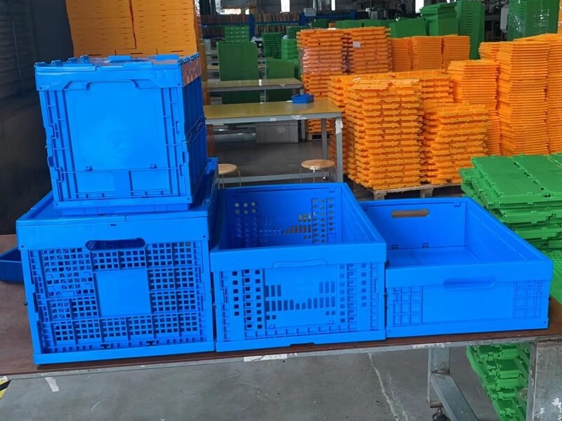Stacked blue plastic crates in a factory, relevant to returns management processes.
