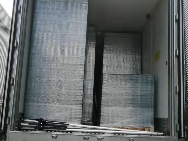 Plastic crates inside a delivery truck, supporting urban delivery route operations.