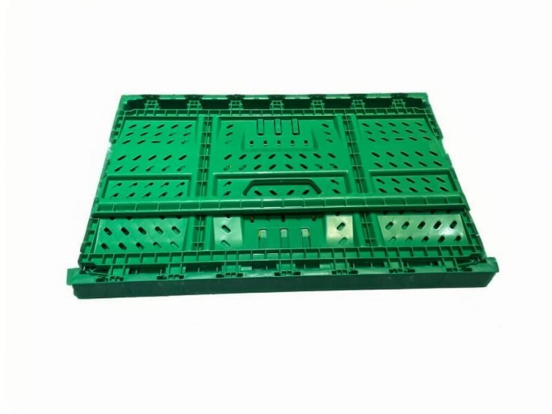 A green plastic crate with a fully collapsible design, ideal for space - saving storage.